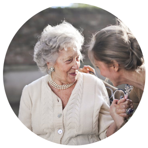 an elderly woman with a caregiver